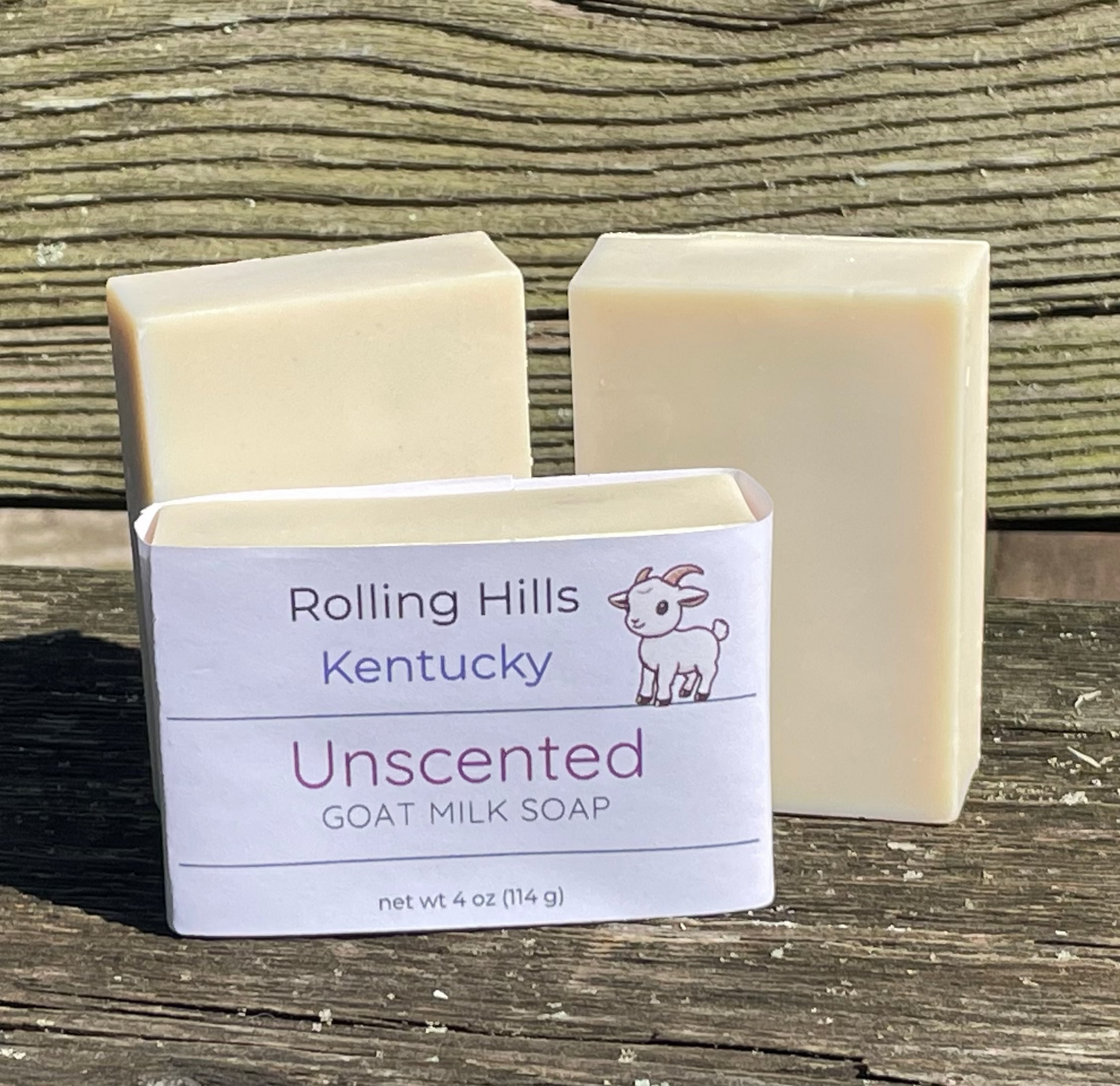 Three bars of Unscented Goat Milk Soap from Rolling Hills on a bench