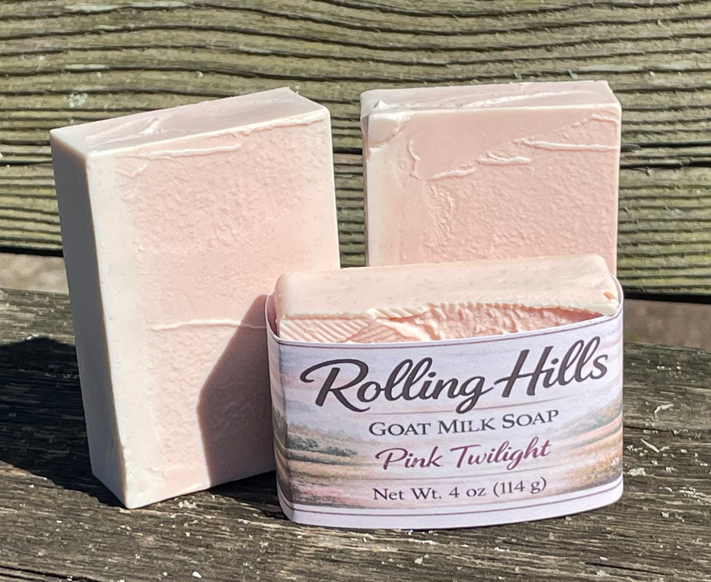 Three bars of soap with 'Rolling Hills' branding on a wooden surface.